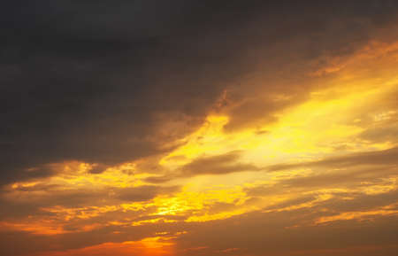 Fiery, orange and red colors sunset sky as backgroundの写真素材