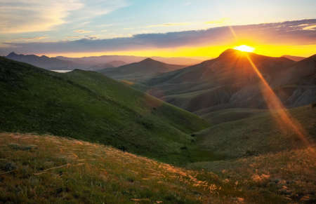 Mountain valley during sunrise. Natural summer landscapeの写真素材