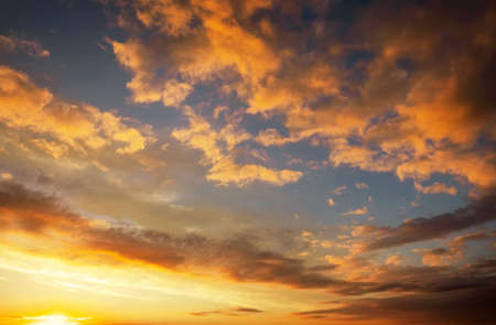 Fiery, orange and red colors sunset sky. Beautiful backgroundの写真素材