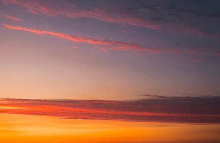 Fiery orange colorful sunset sky as backgroundの写真素材