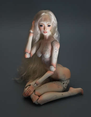 Beautiful porcelain girl on gray background. Bjd dollの写真素材