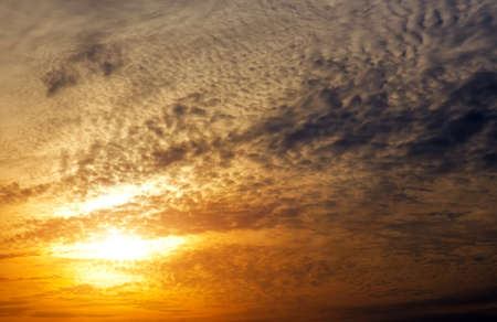 Beautiful fiery sunset sky. Cloudy abstract background. 