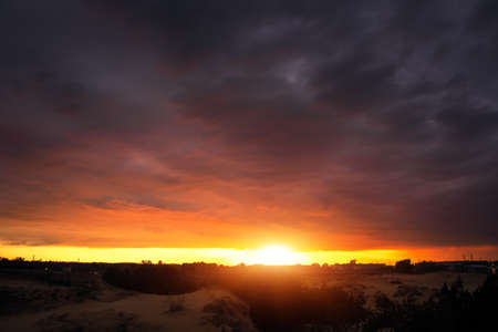 Beautiful fiery orange and red sunset sky.