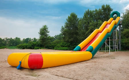 Inflatable water slide on the beach in summer.の写真素材