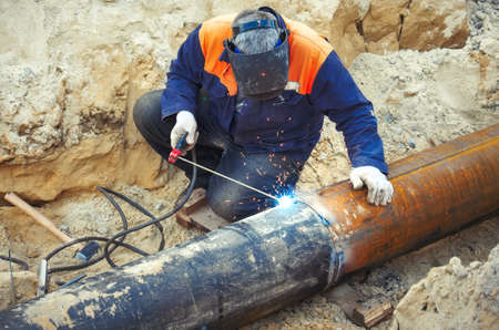 Welding of the pipeline. Process of creation of welding connection by the special mobile tool.の写真素材