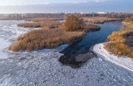 Frozen ice on the shore of the sea as a background, a bird's-eye view. Early winter