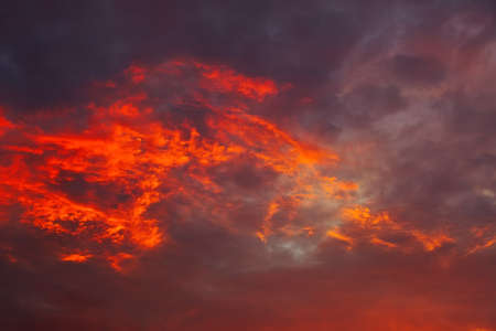 Beautiful fiery, orange and red, sunset sky. Evening Magic Scene. Composition of natureの写真素材