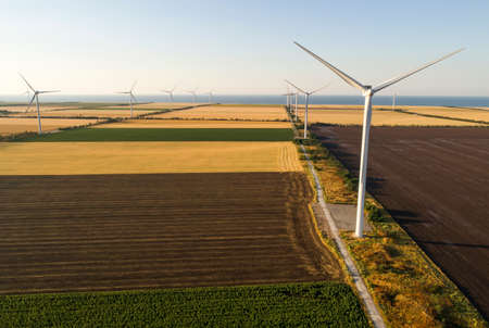 Beautiful landscape with windmills on the field. Birds eye view