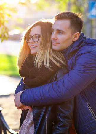 Happy Couple in Autumn street. Fall. Young Family Having Fun Outdoors. Yellow Trees and Leaves. Laughing Woman and man outside. Freedom Concept.
の写真素材