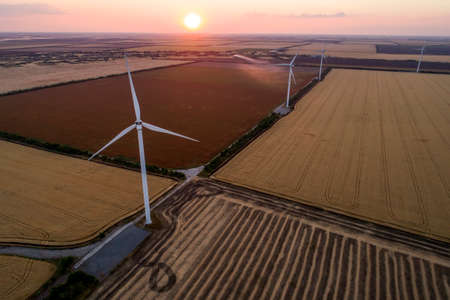 Beautiful landscape with windmills on the field. Birds eye view
