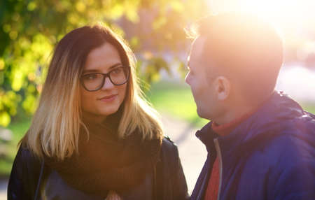 Happy Couple in Autumn street. Fall. Young Family Having Fun Outdoors. Yellow Trees and Leaves. Laughing Woman and man outside. Freedom Concept.
の写真素材