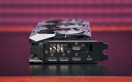 Modern game graphic video card. Computer gaming powerful modern graphic card on the table
の写真素材