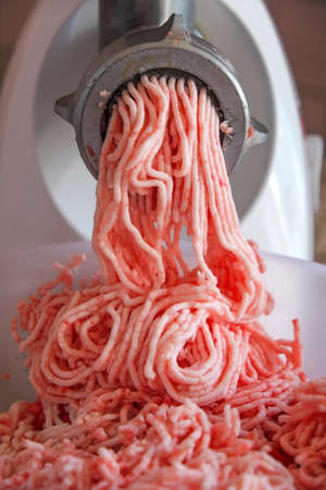 Mincer machine with a fresh chopped meatの写真素材
