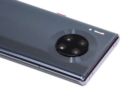 New modern smartphone with four cameras close-up on a white backgroundの写真素材