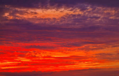 Beautiful Twilight sky background. Colorful Fiery orange and red sunset sky. の写真素材