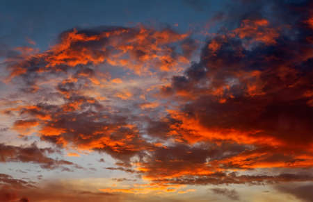 Beautiful Twilight sky background. Colorful Fiery orange and red sunset sky.の写真素材
