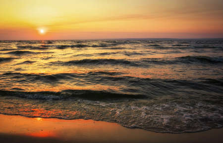 Colorful ocean beach sunrise. Dawn over the sea. Nature compositionの写真素材