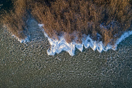 Aerial shot of Winter Lake Or River With Ice Floes