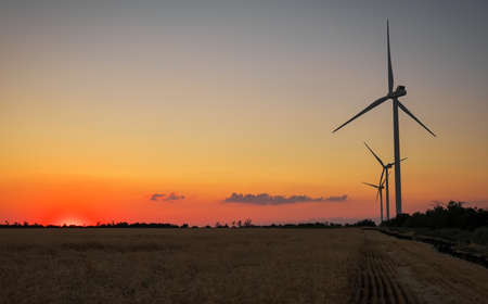 Wind turbines and agricultural field on a summer day. Energy production, clean and renewable energy.
の写真素材