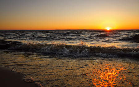 Colorful ocean beach sunrise. Dawn over the sea. Nature compositionの写真素材