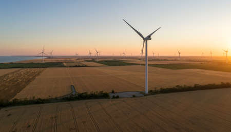 Beautiful landscape with windmills on the field. Birds eye view