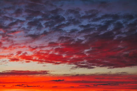Beautiful Twilight sky background. Colorful Fiery orange and red sunset sky.の写真素材