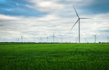 Wind turbines generating electricity with blue sky - energy conservation concept