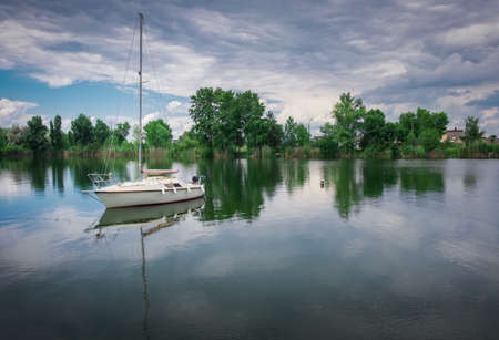 Yachts moored in the port on a cloudy day.の写真素材