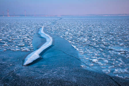 Frozen sea. Beautiful winter landscape with lake in morning time.の写真素材