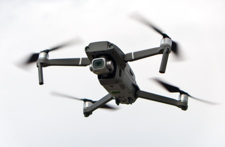A small flying drone with camera in a skyの写真素材