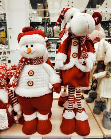 Christmas toys made of wool, beautiful deer, and a snowman are sold in the store, market, realization in the shop, supermarketの写真素材