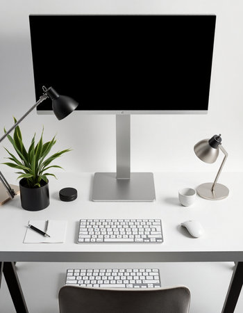 Modern workplace with computer, keyboard, mouse, lamp and other items