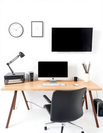Modern workplace with computer, lamp and stationery on white wall backgroundの写真素材
