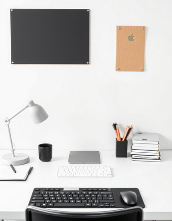 Modern workplace with computer, supplies and stationery on white wall background