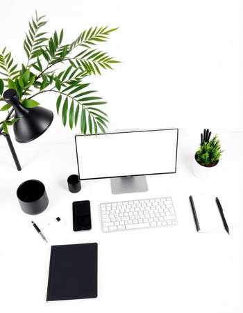 Modern white office desk with computer, supplies, coffee cup and plant. Flat lay, top viewの写真素材