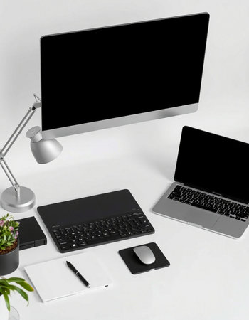 Modern workspace with laptop, tablet, smartphone, coffee cup and other office supplies on white background. Flat lay, top viewの写真素材