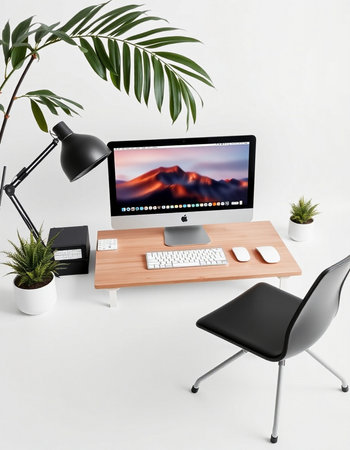 Modern designer desktop with computer, keyboard and mouse on white background.