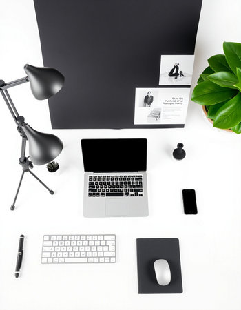 Modern office workspace with laptop, smartphone, coffee cup and other items on white table. Flat...