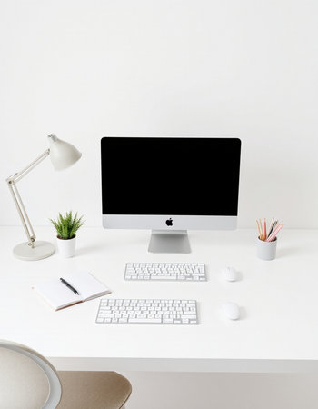 workplace with computer and stationery on white table