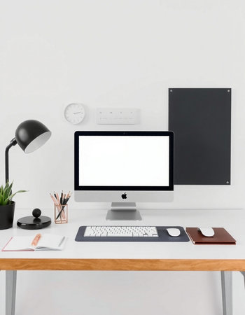 workplace with computer, supplies and stationery on white wall background