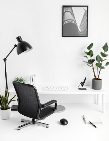 Modern office interior with black armchair, computer and plant.の写真素材