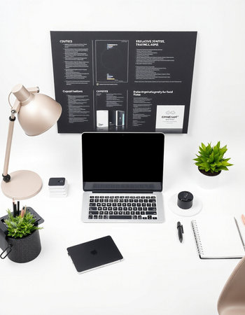 Top view of modern workplace with laptop, stationery and other items on white backgroundの写真素材