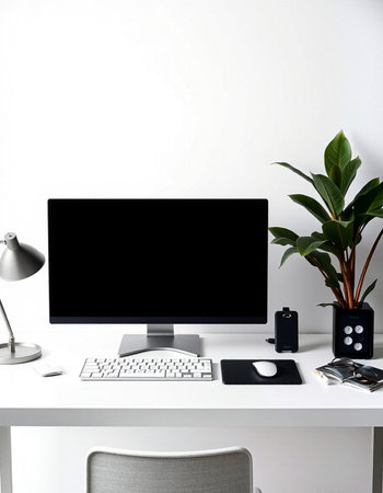 Modern home office desk with computer, keyboard, mouse, stationery and plants