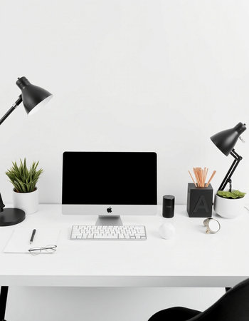 Workplace with computer, lamp and stationery on table in officeの写真素材