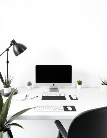 workplace with computer, keyboard, mouse, lamp and plant on white backgroundの写真素材