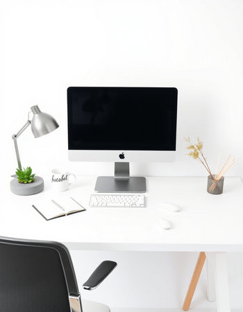 Modern workplace with blank screen computer, stationery and accessories on white table