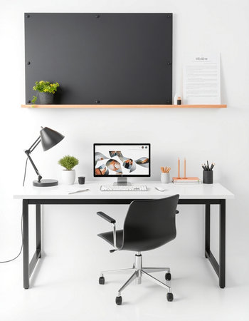 Workplace with computer on table, lamp and chair in modern officeの写真素材