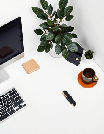 White office desk table with computer, coffee cup, notebook, smartphone and plant. Flat lay, top...