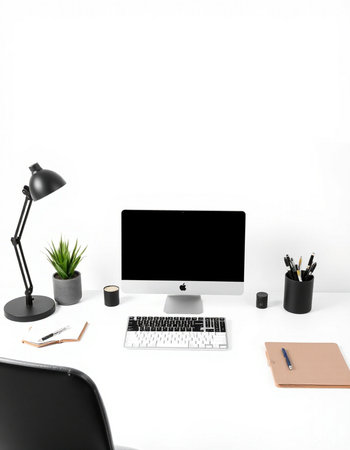 Modern workplace with computer, stationery and coffee cup on white backgroundの写真素材