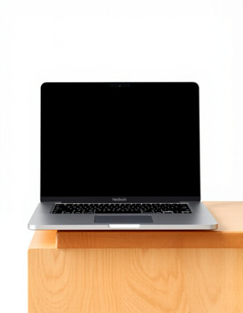Laptop with blank screen on wood shelf isolated on white background.